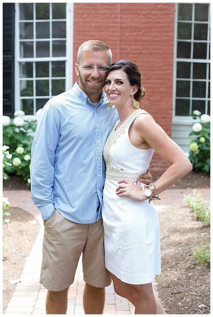 Meghan Grant wearing her white & gold dress and taking a photo with her husband Meghan Grant wearing her white & gold dress and taking a photo with her husband