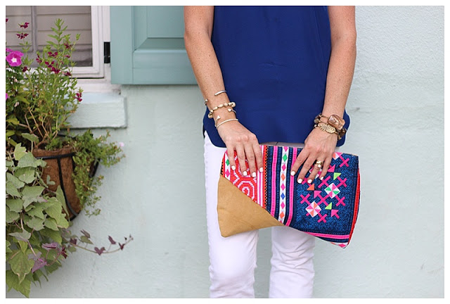 woman in Navy & White outfit with printed pouch 