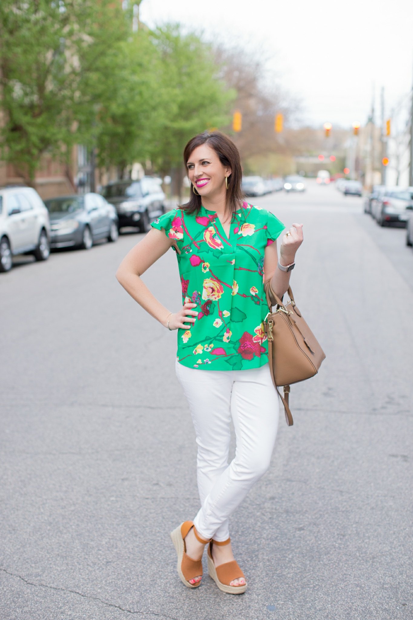 J.Crew Factory Floral Top featured by top US fashion blog I'm Fixin' To; Image of a woman wearing J. Crew Factory floral top, J. Crew high-waisted jeans, Steve Madden wedges, Tory Burch tote, Sheila Fajl hoops, David Yurman bangle and Moon & Lola Cheshire necklace.