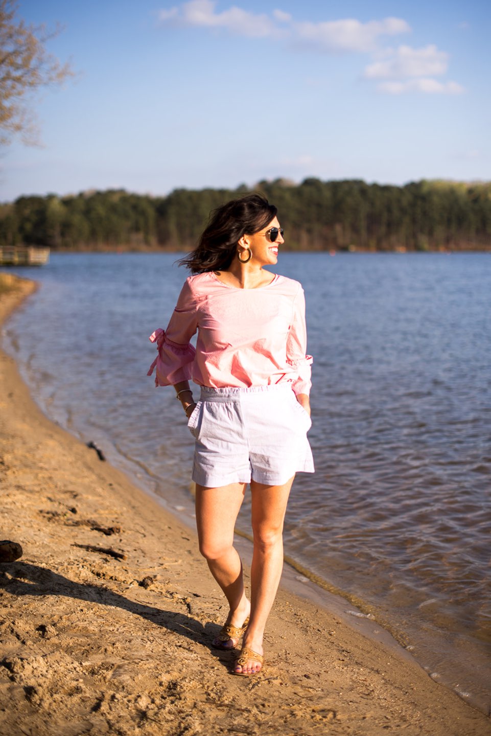 Casual Spring Outfits featured by top US fashion blog I'm Fixin' To; Image of a woman wearing J. Crew Factory Linen Tie Top, J. Crew Factory Seersucker Shorts, David Yurman Bangle, Sheila Fajl Hoops, Ray-Ban Polarized Aviators and Jack Rogers Sandals.
