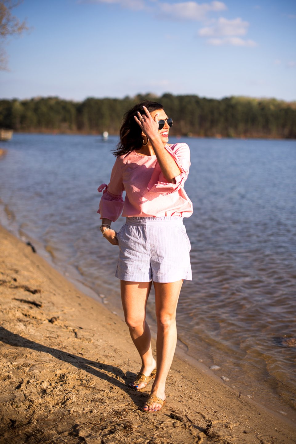 Casual Spring Outfits featured by top US fashion blog I'm Fixin' To; Image of a woman wearing J. Crew Factory Linen Tie Top, J. Crew Factory Seersucker Shorts, David Yurman Bangle, Sheila Fajl Hoops, Ray-Ban Polarized Aviators and Jack Rogers Sandals.