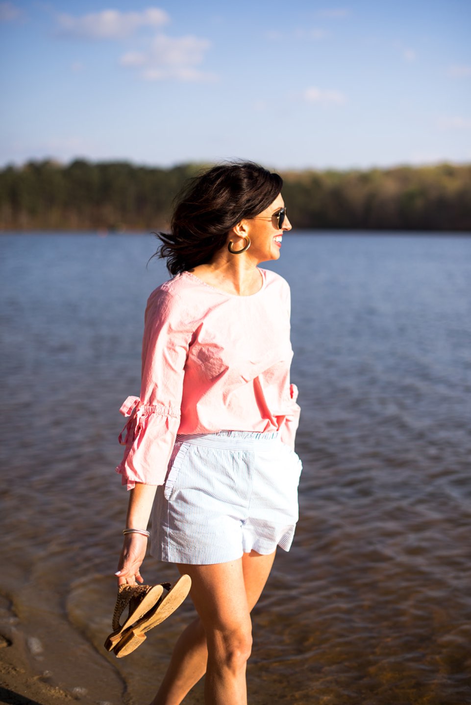 Casual Spring Outfits featured by top US fashion blog I'm Fixin' To; Image of a woman wearing J. Crew Factory Linen Tie Top, J. Crew Factory Seersucker Shorts, David Yurman Bangle, Sheila Fajl Hoops, Ray-Ban Polarized Aviators and Jack Rogers Sandals.