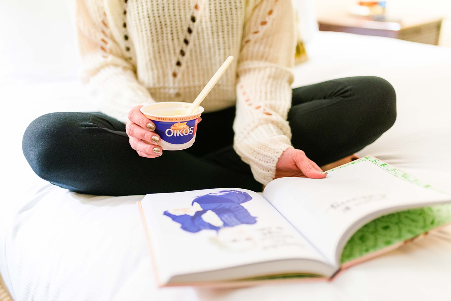 A Quick Dessert Idea that Will Satisfy your Cravings - I'm Fixin' To - @mbg0112 | Oikos, a quick desert idea that will satisfy your sweet cravings, featured by top US lifestyle blog, I'm Fixin To: image of a woman eating an Oikos yogurt