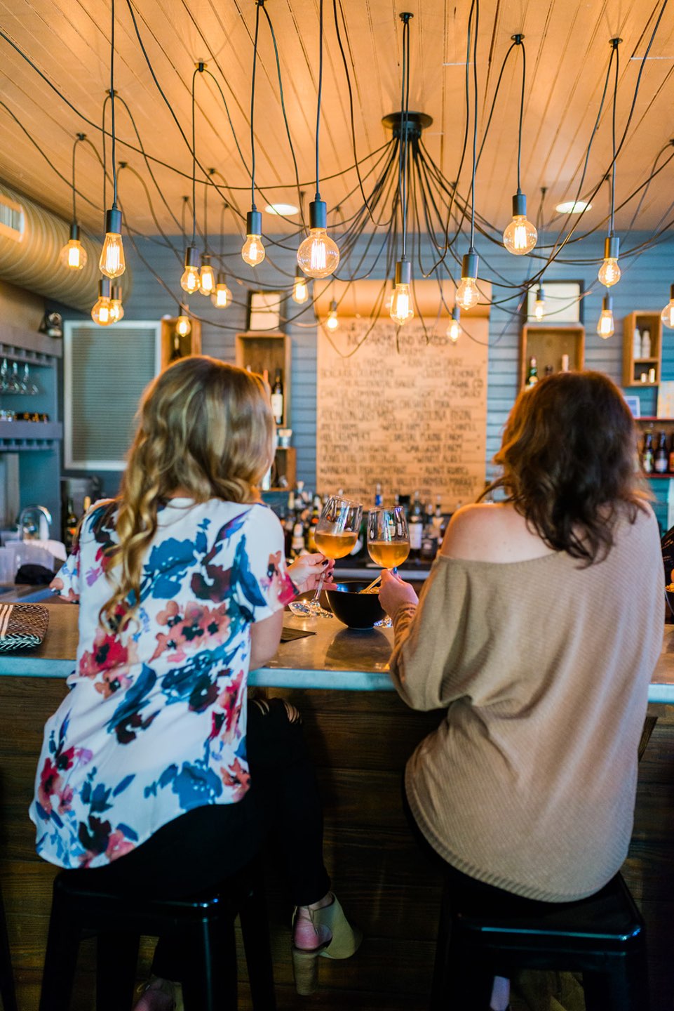 two women drinking wine
