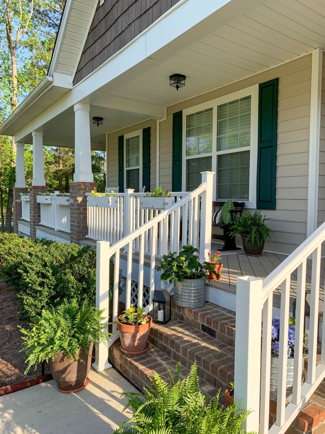 How to Update Your Front Porch Decor for the Season - I'm Fixin' To - @mbg0112  | Front Porch Decor for Spring featured by top US lifestyle blog, I'm Fixin' To: image of plants being planted