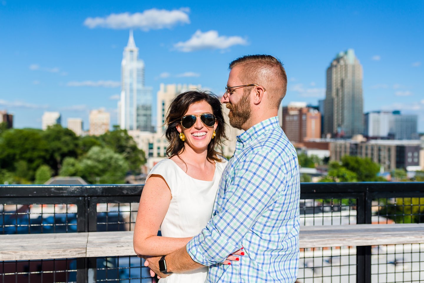 Celebrating 5 Years of Marriage: Lessons Learned - I'm Fixin' To - @mbg0112 Celebrating 5 Years of Marriage: Lessons Learned - I'm Fixin' To - @mbg0112 | Celebrating 5 Years of Marriage: Lessons Learned by popular North Caroline Life and Style blog, I'm Fixin' To: image of husband and wife standing next to each other outside and holding hands. Woman is wearing a Gal Meets Glam jumpsuit, Nordstrom Ebba Sandal by ONO, Ray-Ban Original Aviator Polarized Sunglasses, and Hunter Blake Earrings.