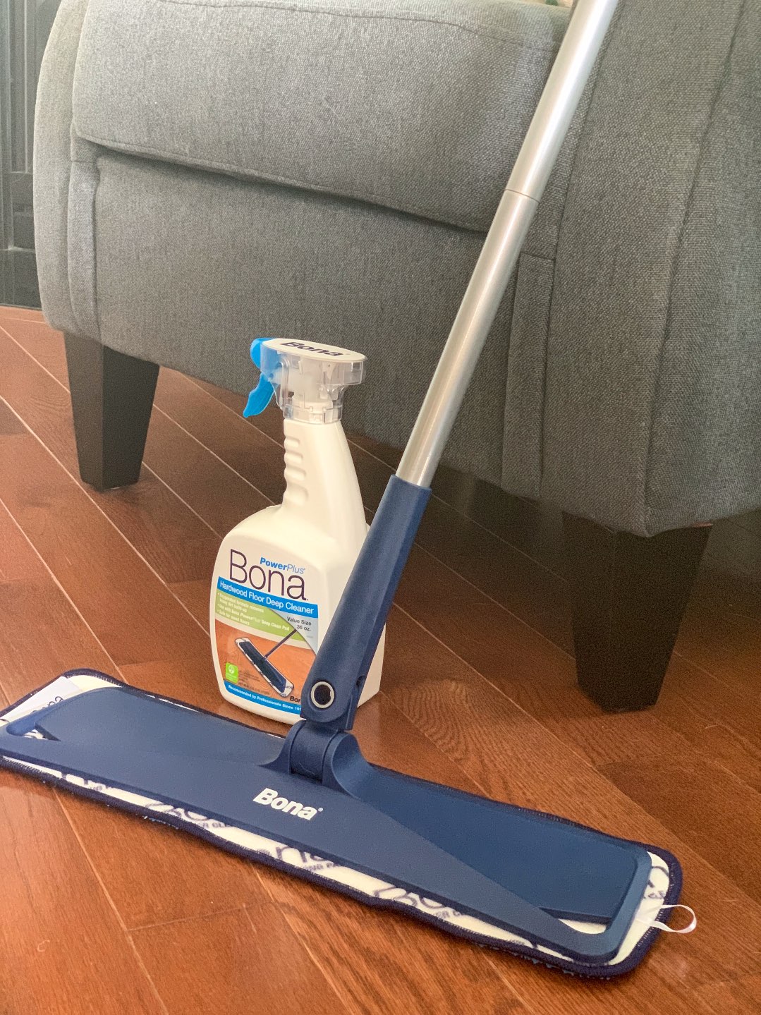 Keeping Our Floors Clean with Bona Essentials - I'm Fixin' To - @mbg0112 | Keeping Our Floors Clean with Bona Essentials by popular lifestyle blog, I'm Fixin' To: image of a bottle of Bona Essentials Hardwood Floor Deep Cleaner next to a Bona Essentials Mop.