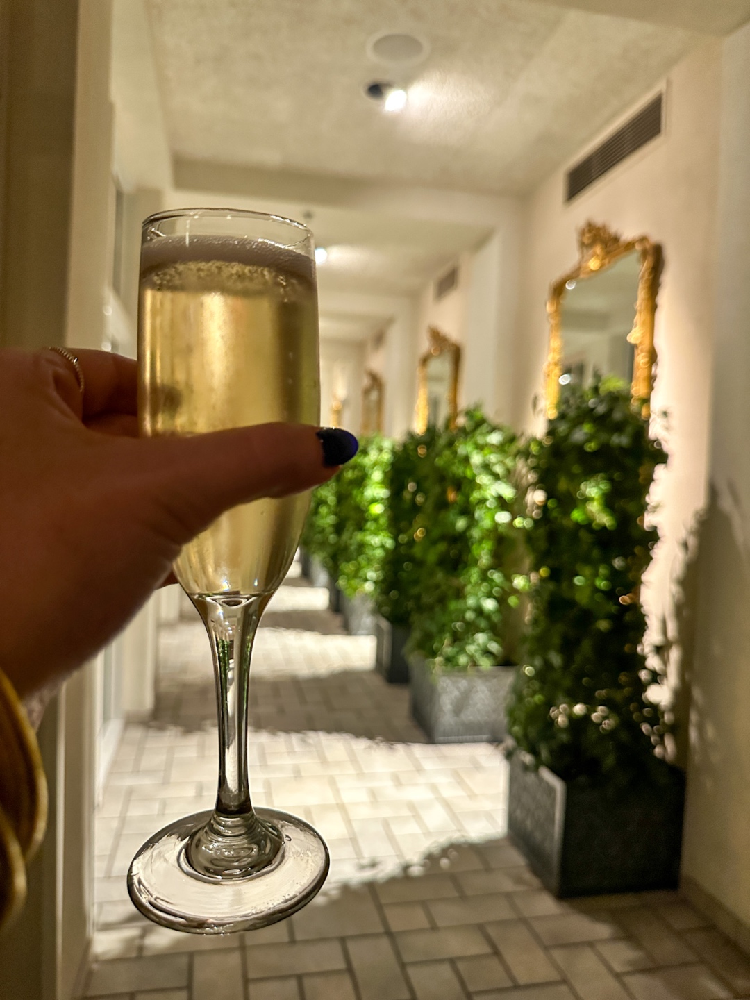 Meghan Grant holding a glass of Champaign