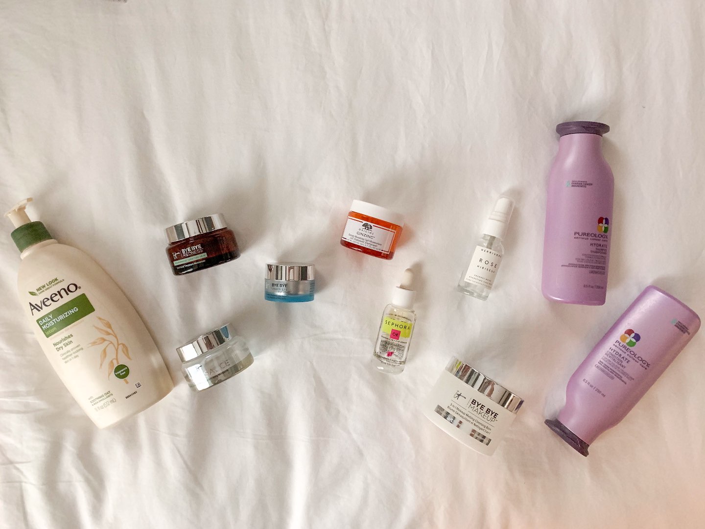 Product Empties: What I Repurchased - I'm Fixin' To - @mbg0112 | Product Empties: Amazon Favorites I Repurchased by popular North Carolina lifestyle blog, I'm Fixin' To: image of Aveeno Daily Moisturizing, IT bye by makeup, pureology shampoo, pureology conditioner, Origins Ginzing Energy-Boosting Gel Moisturizer, It Cosmetics Bye Bye Redness Skin Relief Treatment Moisturizer, It Cosmetics Secret Sauce Anti-Aging Moisturizer, It Cosmetics Bye Bye Under Eye Eye Cream, Sephora Vitamins C + E Super Serum, and Herbivore Rose Hibiscus Hydrating Face Spray.    