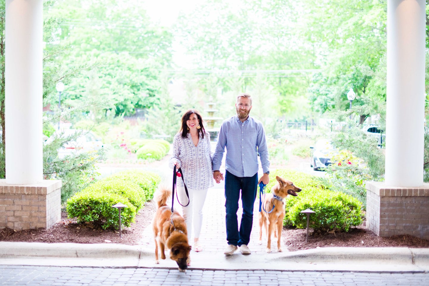 Welcome August + July 2019 Instagram Roundup - I'm Fixin' To - @mbg0112 | Welcome August + July 2019 Instagram Roundup by popular North Carolina life and style blog, I'm Fixin' To: image of a woman and her husband walking their two dogs at the Siena Hotel.