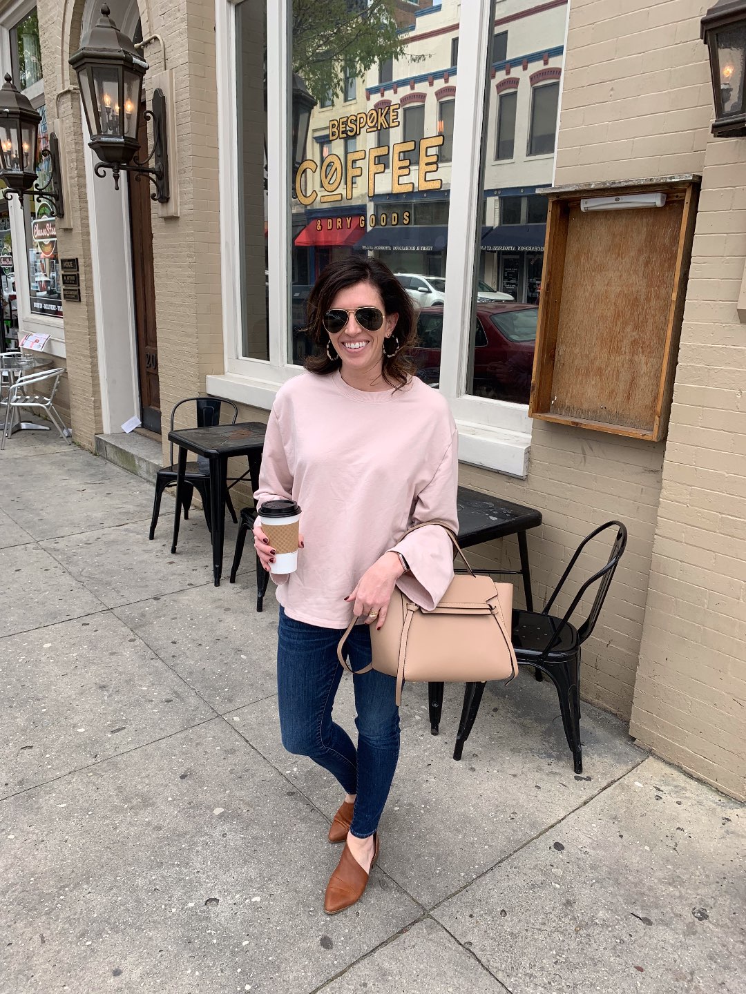 One Year Since Hurricane Florence in North Carolina and How to Help Ocracoke by popular North Carolina blog, I'm Fixin' To: image of a woman standing in front of Bespoke Coffee.