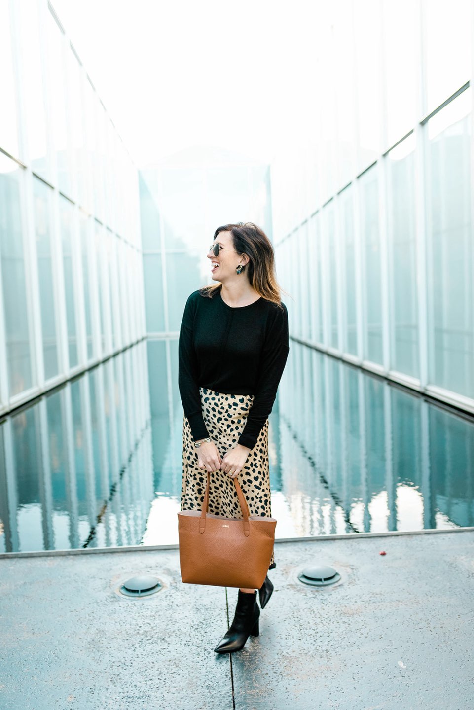 4 Outfit Ideas for Thanksgiving Supper - I'm Fixin' To - @mbg0112 | 4 Thanksgiving Outfit Ideas by popular North Carolina fashion blog, I'm Fixin' To: image of a woman outside wearing a H&M Fine-knit Top, Amazon Pajamasea High Waist Leopard Midi Skirt Hidden Elasticized Waistband, and Nordstrom Marc Fisher Unique Bootie.