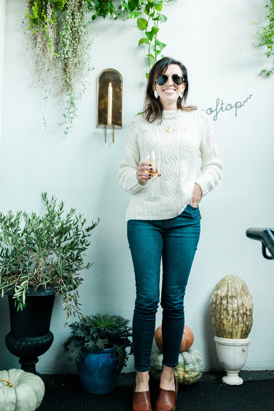 4 Outfit Ideas for Thanksgiving Supper - I'm Fixin' To - @mbg0112 | 4 Thanksgiving Outfit Ideas by popular North Carolina fashion blog, I'm Fixin' To: image of a woman outside wearing a J. Crew Pointelle cable sweater, J. Crew 8" toothpick jean in Vista wash, Target Universal Thread Women's Rylie Faux-Leather Heeled Open Bootie, and Hart JANUS LUCKY COIN NECKLACE.