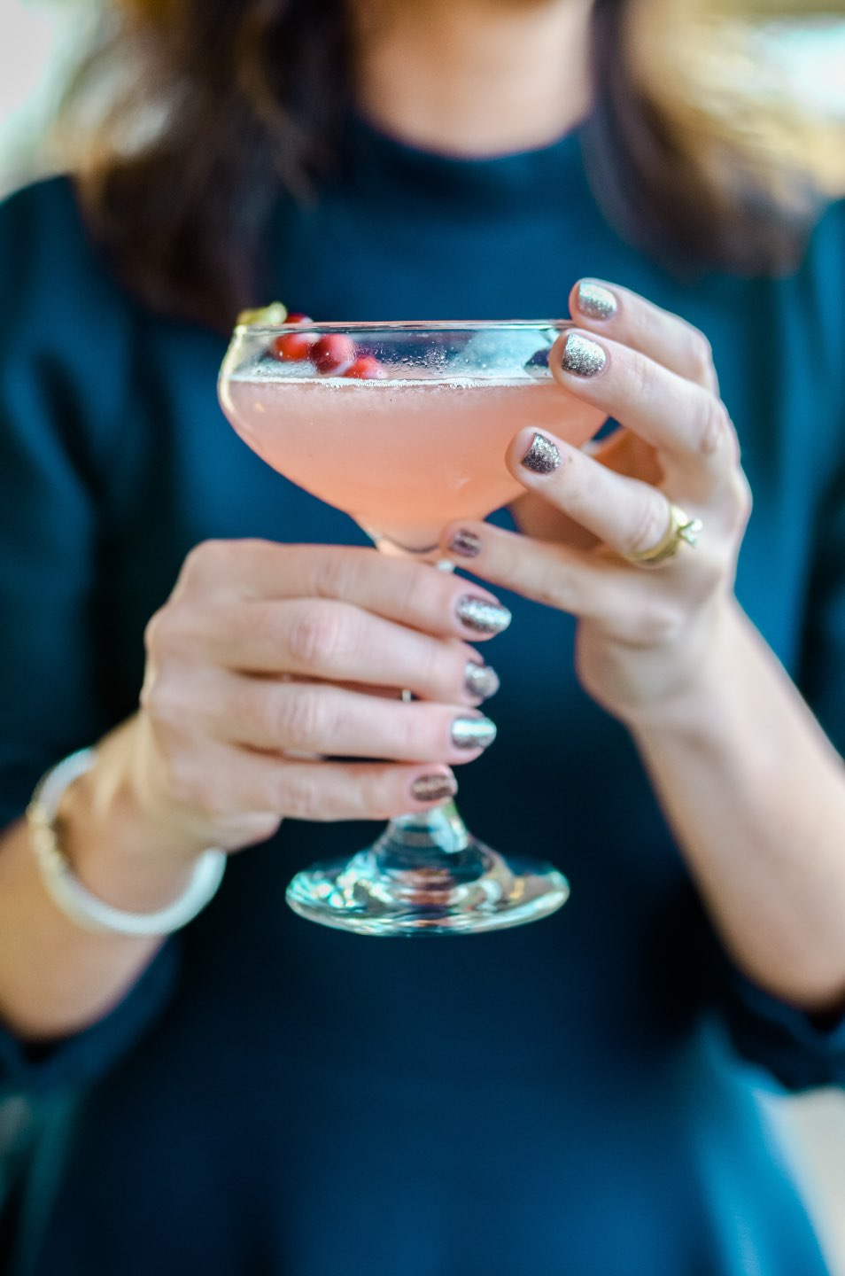 Holiday Style and Outfit Inspiration - I'm Fixin' To - @mbg0112n | Holiday Style and Outfit Inspiration by popular North Carolina fashion blog, I'm Fixin' To: image of a woman holding a holiday cocktail.