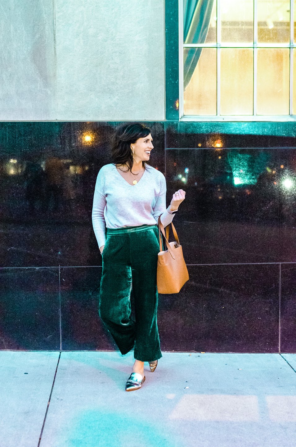 Holiday Style and Outfit Inspiration - I'm Fixin' To - @mbg0112 | Holiday Style and Outfit Inspiration by popular North Carolina fashion blog, I'm Fixin' To: image of a woman outside wearing a Loft FLECKED LUXE KNIT V-NECK SWEATER, J. Crew Pull-on Peyton pant in velvet, metallic mules, Cuyana Small Structured Leather Tote, Nordstrom David Yurman Cable Classic Buckle Bracelet with 18K Gold, Nordstrom David Yurman Cable Classics Bracelet with 14K Gold, Nordstrom Mignonne Gavigan Earrings, and Sephora Bite Beauty lipstick.