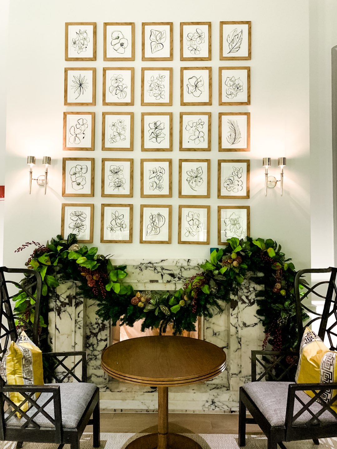 Warming Up in the Bahamas: the Best Things to Do at Baha Mar - I'm Fixin' To - @mbg0112 | Warming Up in the Bahamas: the Best Things to Do in Baha Mar by popular North Carolina travel blog, I'm Fixin' To: image of a black and white portrait wall. 