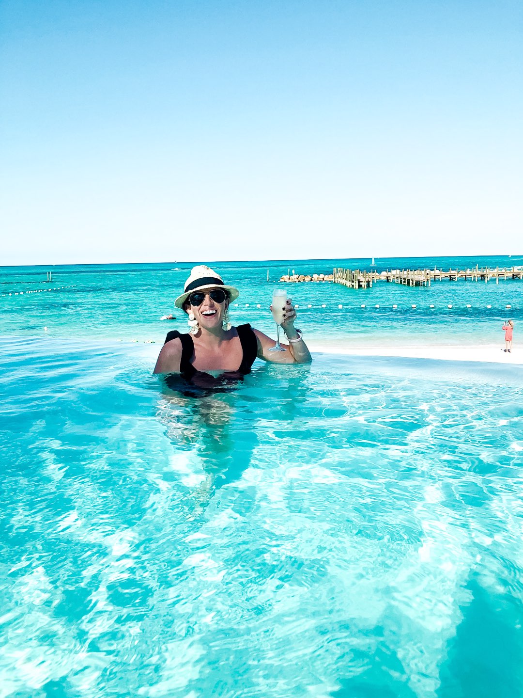 Warming Up in the Bahamas: the Best Things to Do at Baha Mar - I'm Fixin' To - @mbg0112 | Warming Up in the Bahamas: the Best Things to Do in Baha Mar by popular North Carolina travel blog, I'm Fixin' To: image of a woman in a an infinity pool. 