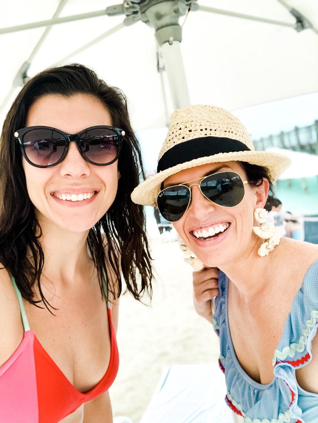 Warming Up in the Bahamas: the Best Things to Do at Baha Mar - I'm Fixin' To - @mbg0112 | Warming Up in the Bahamas: the Best Things to Do in Baha Mar by popular North Carolina travel blog, I'm Fixin' To: image of two women wearing sunglasses and swimsuits at the beach. 