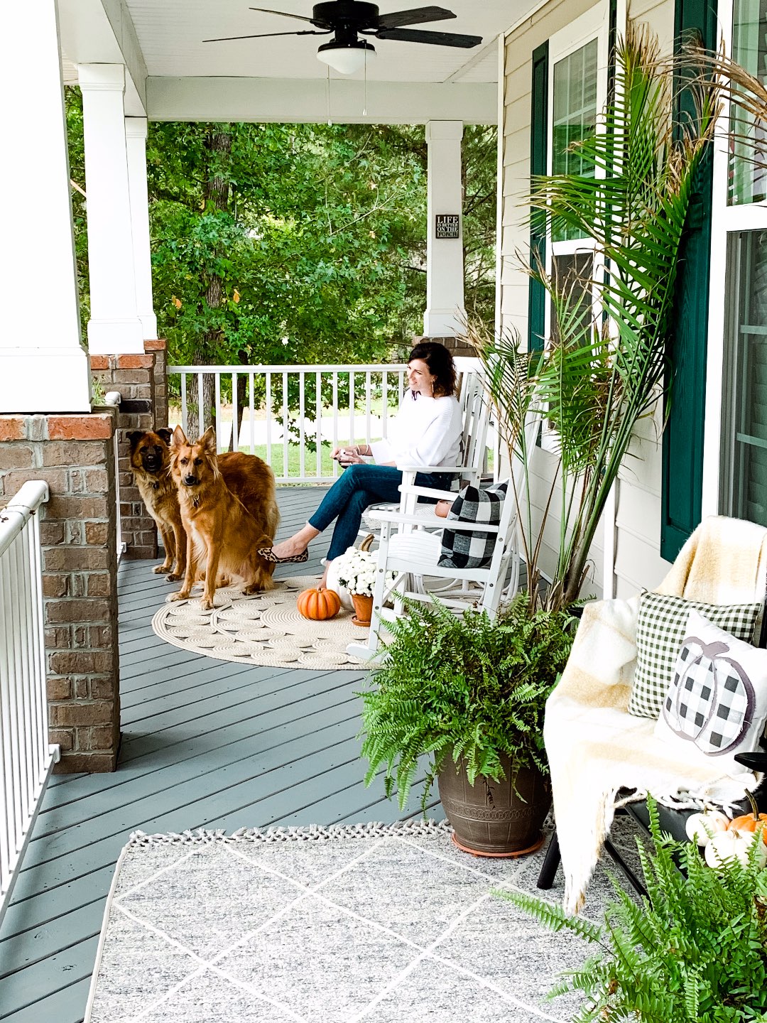 How to Set Healthy Boundaries with Friends: 8 Essential Tips - I'm Fixin' To - @mbg0112 | How to Set Healthy Boundaries with Friends: 8 Essential Tips by popular NC life and style blog, I'm Fixin' To: image of a woman sitting on her front porch with her two dogs.