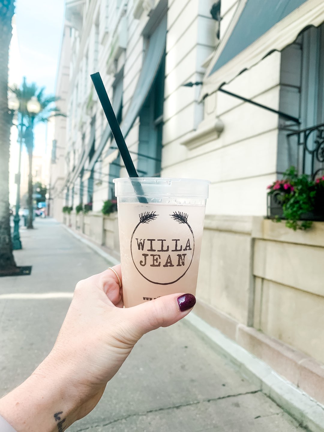 A Girls Trip to New Orleans: All the Info you Need to Prepare! - I'm Fixin' To - @mbg0112 | Girls Trip to New Orleans by popular US travel blog, I'm Fixin To: image of a woman holding a Willa Jean cup. 