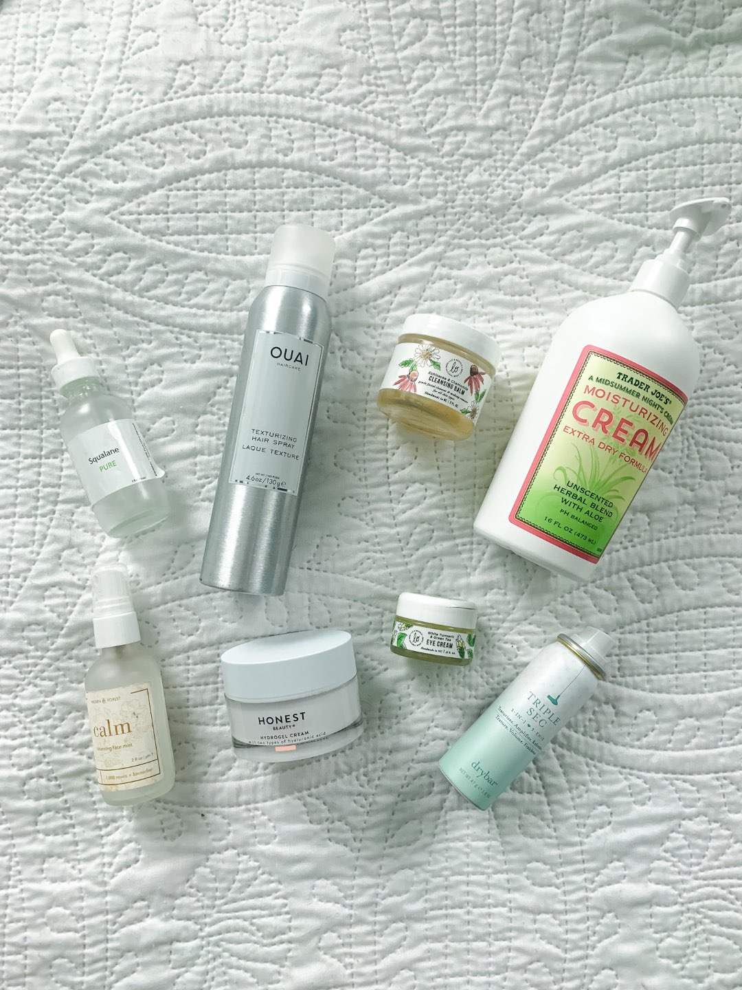 Recent Product Empties: What I Repurchased - I'm Fixin' To - @mbg0112 | Product Empties by popular Raleigh lifestyle blog, I'm Fixin' To: image of Trader Joe's moisturizing cream, Ouai texturizing hairspray, Drybar Triple See Spray, Lo & Behold Turmeric and Green Tea eye cream, Honest Beauty Hydrogel cream, Pure Squalane oil, Hidden Forest Calm hydrating face mist, and Lo & Behold Cleansing Balm.