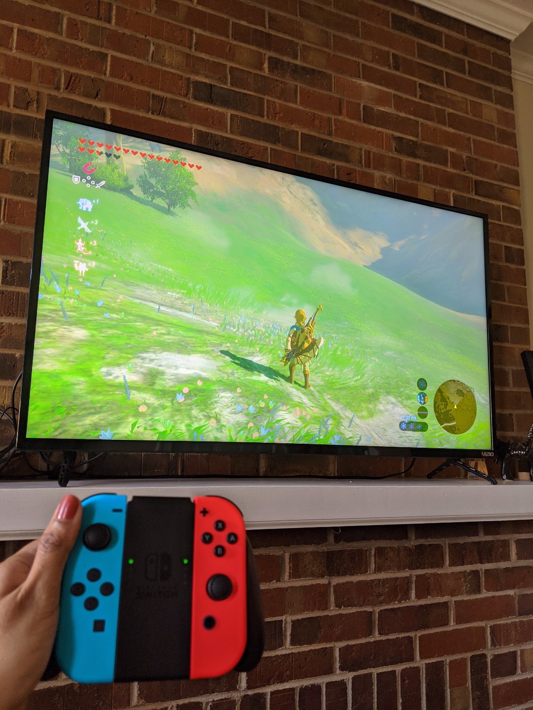 How to Make the Most of Your Time by popular N.C. lifestyle blog, I'm Fixin' To: image of a woman playing Nintento Switch.