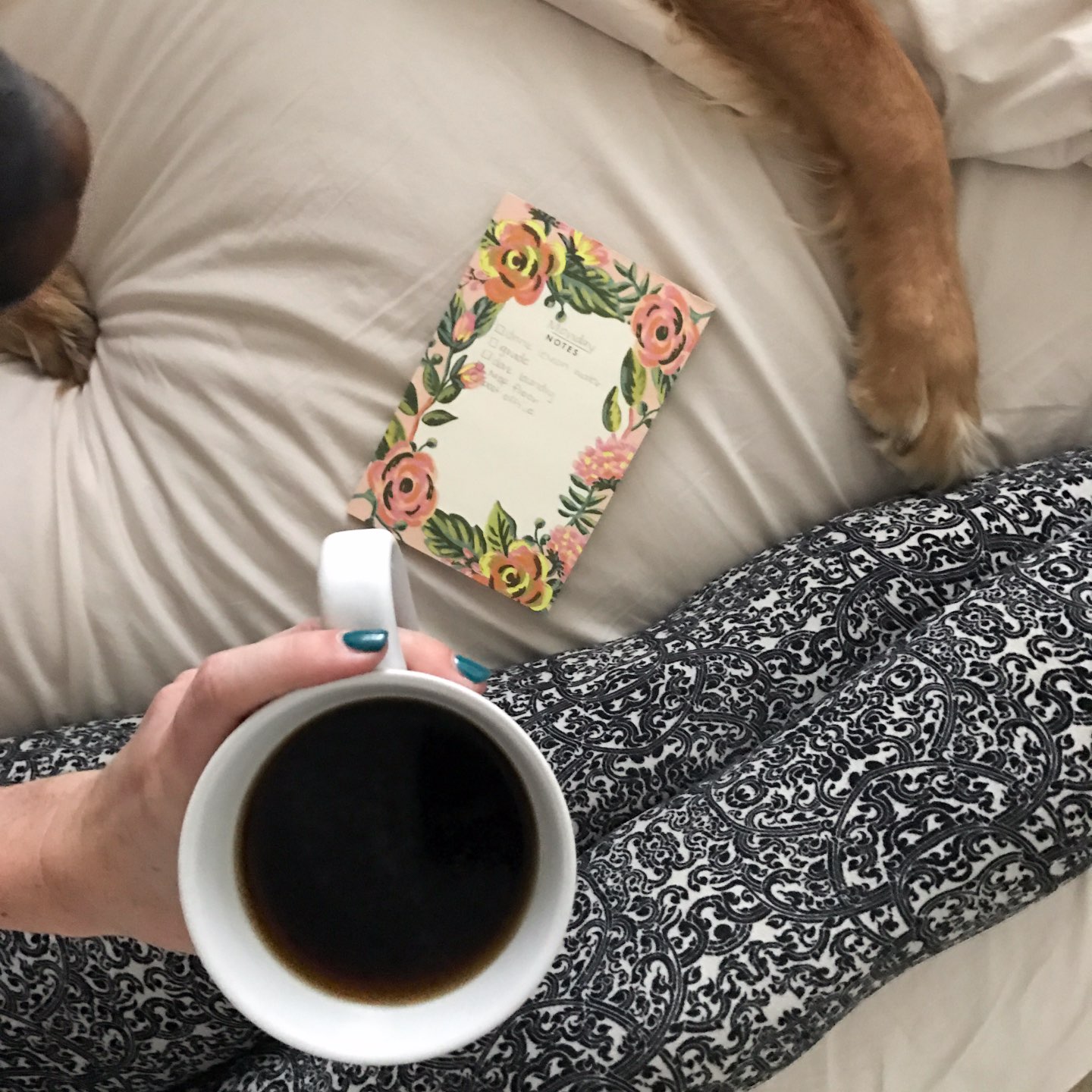 How I'm Learning to Do Nothing - I'm Fixin' To - @mbg0112 |  Learning to do Nothing by popular N.C. lifestyle blog, I'm Fixin' To: image of a woman sitting on her bed and holding a mug of coffee. 