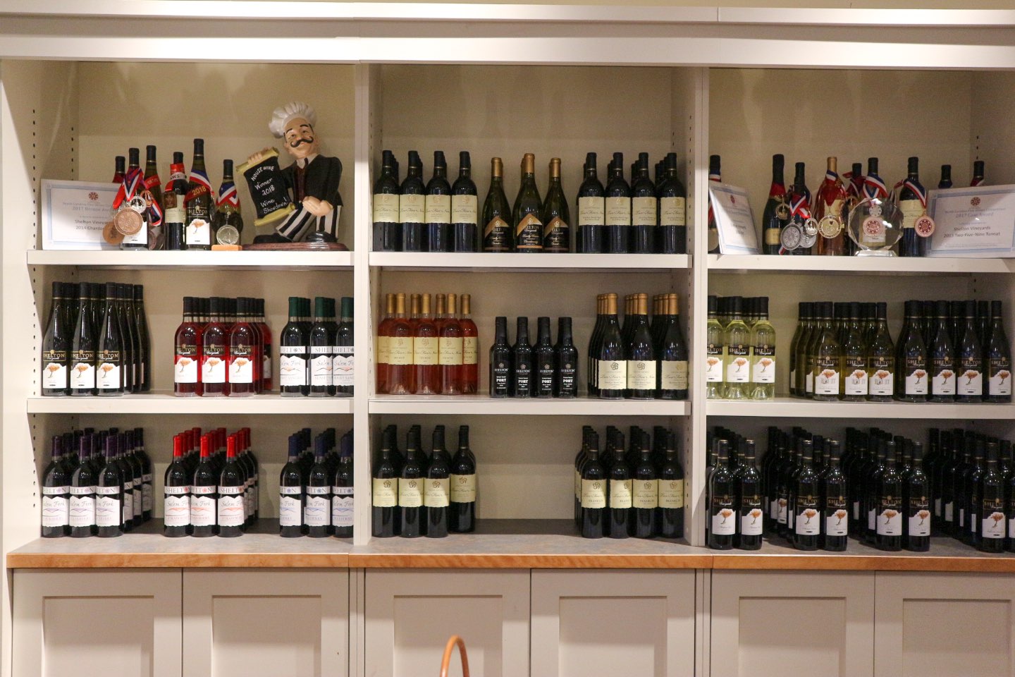 Celebrate North Carolina Wines during NC Wine Month - I'm Fixin' To - @mbg0112 | North Carolina Wine by popular North Carolina blog, I'm Fixin' To: image of various North Carolina wines on shelves. 