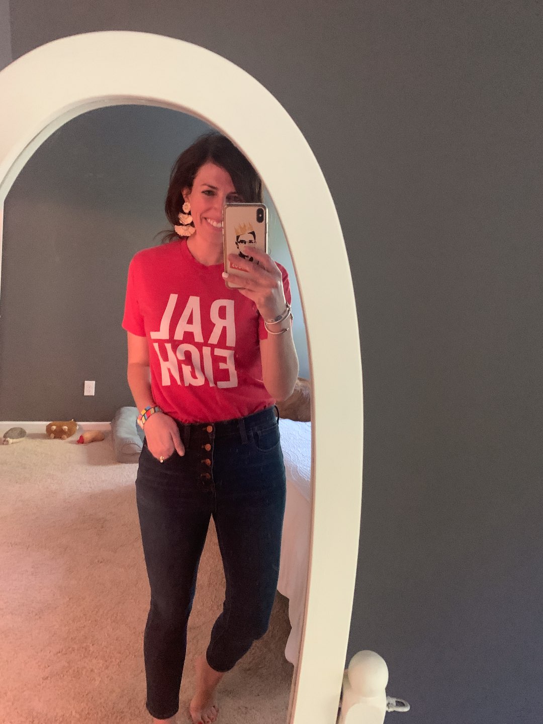 5 Stylish Teleworking Outfits for Women - I'm Fixin' To - @mbg0112 | Teleworking Outfits for Women by popular North Carolina fashion blog, I'm Fixin' To: image of a woman wearing a Raleigh t-shirt and J.Crew 9" high-rise toothpick jean in Classic Rinse wash.