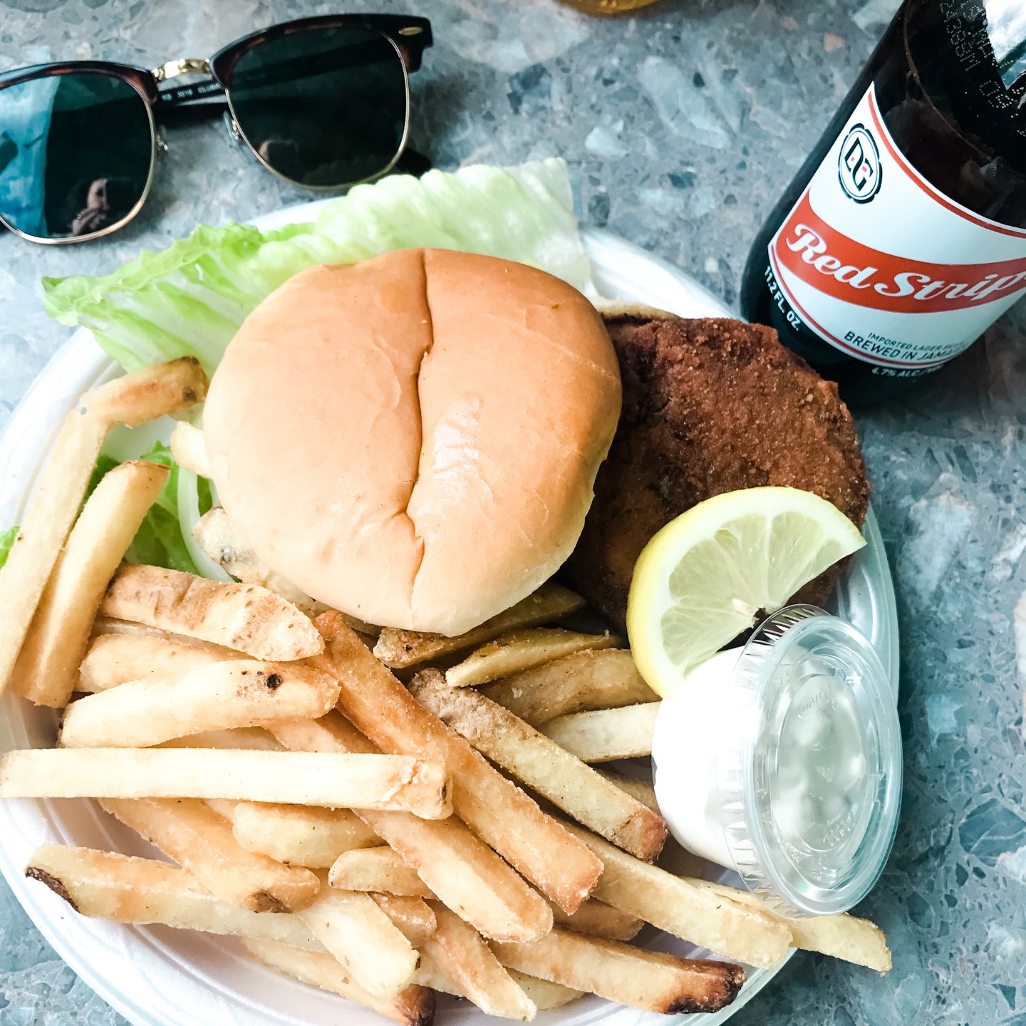 10 North Carolina Destinations Perfect for a Socially Distant Getaway - I'm Fixin' To - @mbg0112 | North Carolina Destinations by popular North Carolina blog, I'm Fixin' To: image of a chicken sandwich and french fries. 
