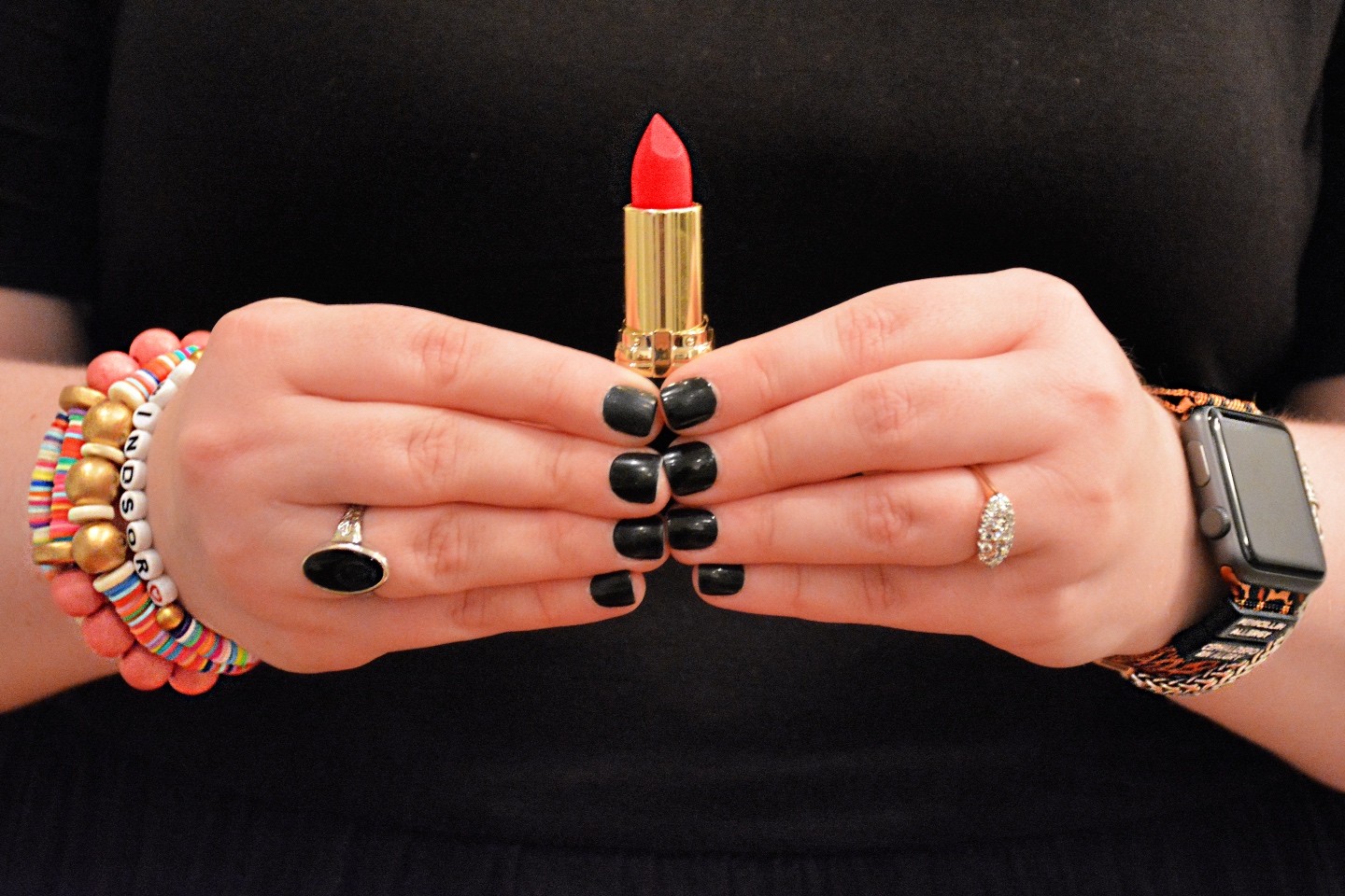 The Empowered Women Series: How to Rock a Red Lip with Hannah Dawson - I'm Fixin' To - @mbg0112 | Hannah Hardy by popular NC beauty blog, I'm Fixin' To: image of Hannah Hardy holding a tube of red lipstick. 