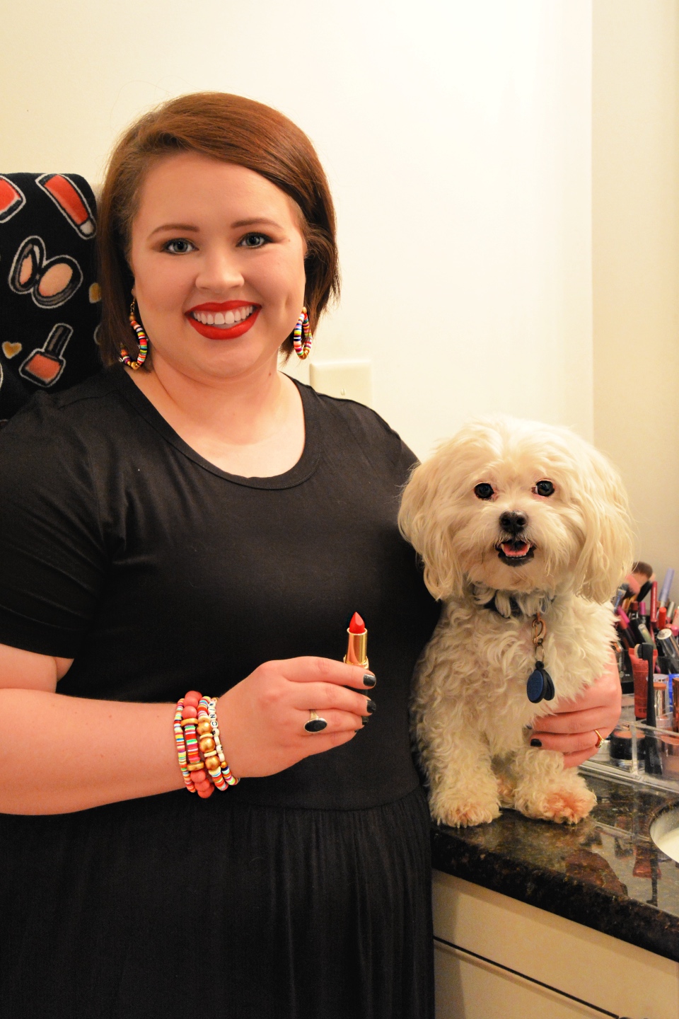 The Empowered Women Series: How to Rock a Red Lip with Hannah Dawson - I'm Fixin' To - @mbg0112 | Hannah Hardy by popular NC beauty blog, I'm Fixin' To: image of Hannah Hardy applying red lipstick and standing next to her dog. 