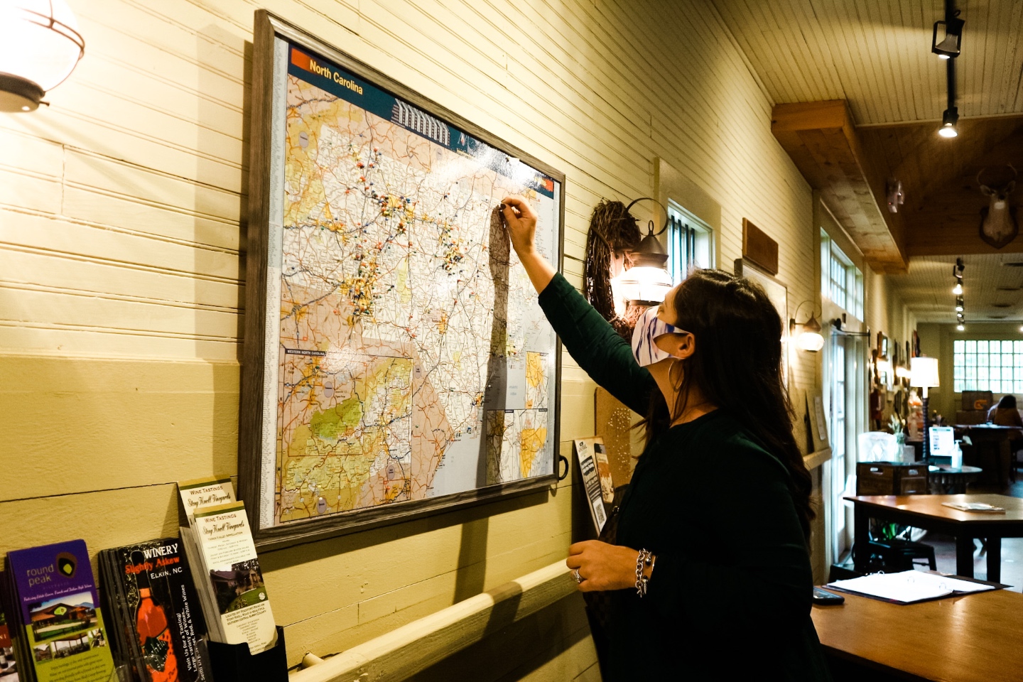Western NC Wineries: 6 Wineries to Visit During your Next Girls' Weekend - I'm Fixin' To - @mbg0112 |Western NC Wineries by popular NC blog, I'm Fixin' To: image of a woman putting a pin in a Map. 