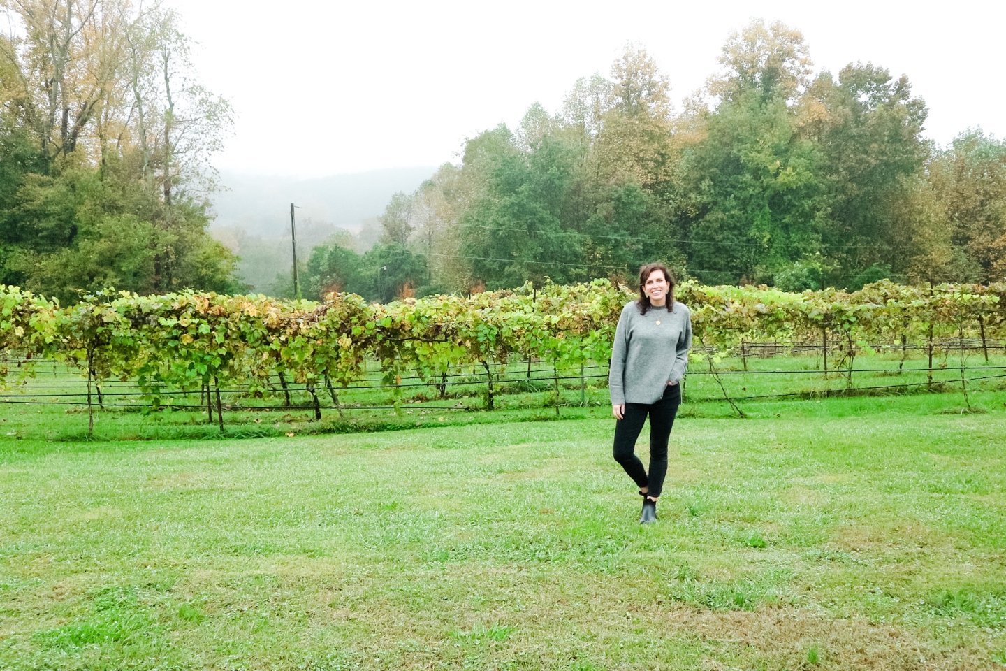 Western NC Wineries: 6 Wineries to Visit During your Next Girls' Weekend - I'm Fixin' To - @mbg0112 |Western NC Wineries by popular NC blog, I'm Fixin' To: image of a woman at Carolina Heritage vineyard and winery. 