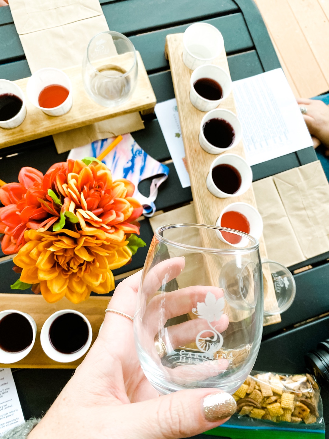 Western NC Wineries: 6 Wineries to Visit During your Next Girls' Weekend - I'm Fixin' To - @mbg0112 |Western NC Wineries by popular NC blog, I'm Fixin' To: image of women sampling wine at Carolina Heritage vineyard and winery. 