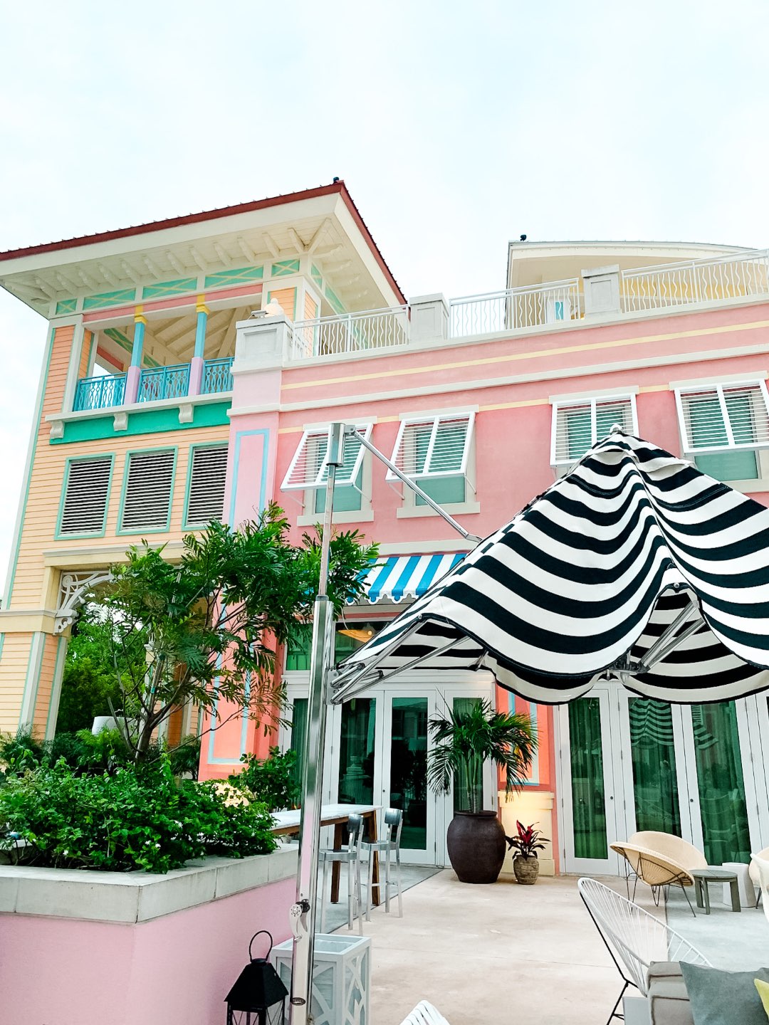 Year in Review by popular NC travel blog, I'm Fixin' To: image of a pink, yellow, green, and blue building in Nassau.