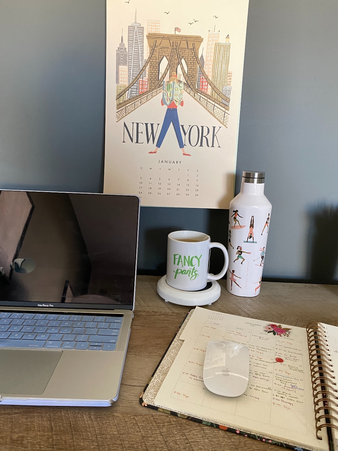 How to Make your Home Cozy: 10 Easy Ways - I'm Fixin' To - @imfixintoblog |How to Make Your Home Cozy by popular NC life and style blog, I'm Fixin' To: image of a open Mac laptop next to a ceramic mug on a mug warmer and a open day planner. 