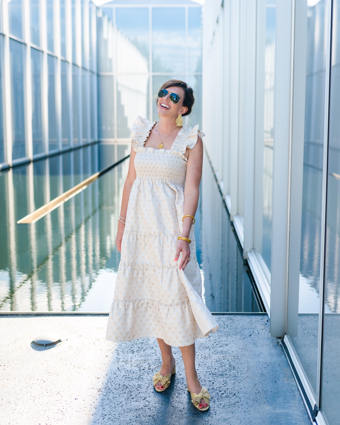 Recent Favorites: Top 10 Things I've Bought that Are Worth the Hype - I'm Fixin' To - @imfixintoblog | Recent Favorites by popular NC life and style blog, I'm Fixin' To: image of a woman wearing a Hill House nap dress with gold bow shoes, gold statement earrings and aviator sunglasses. 
