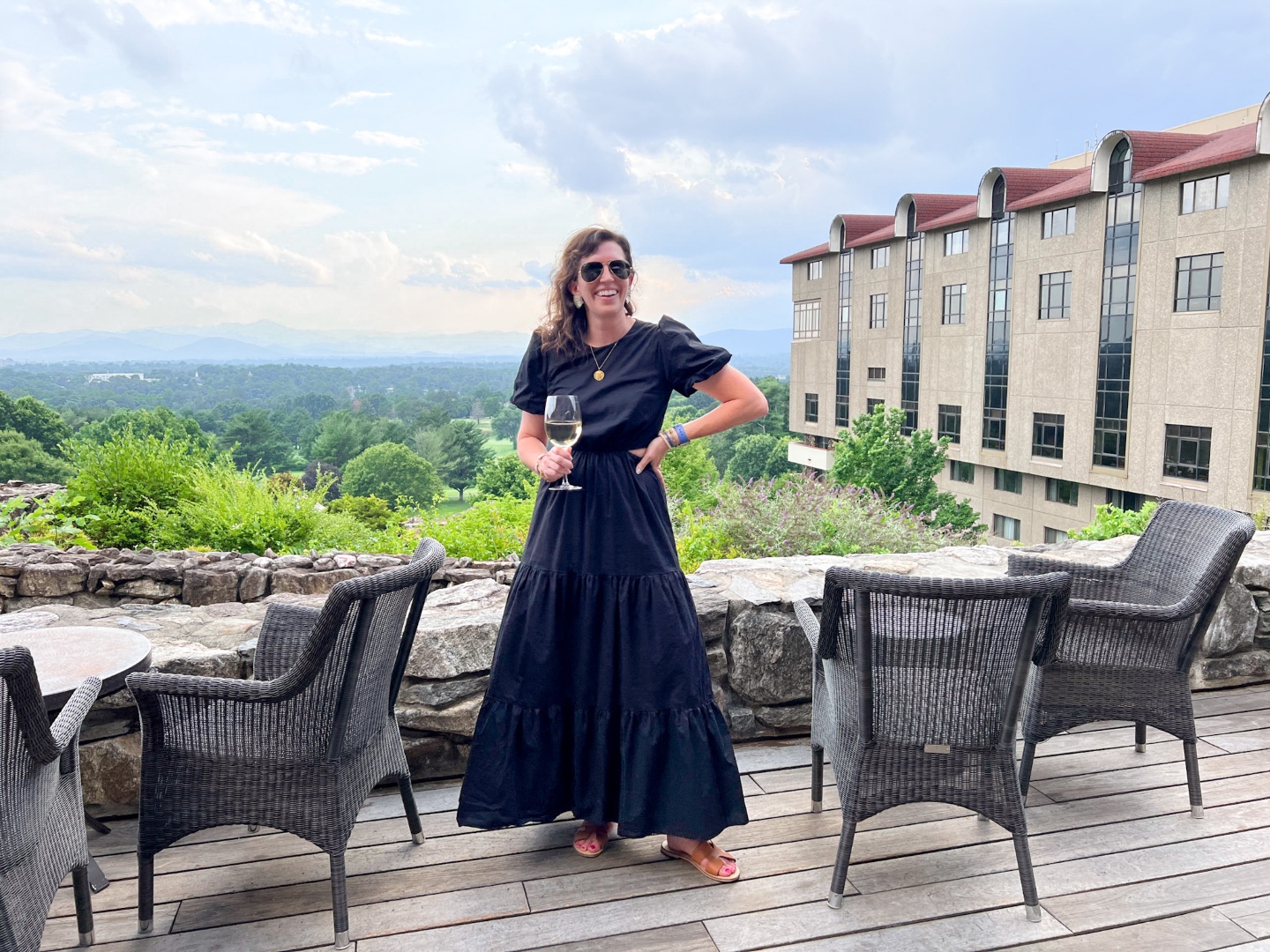 woman at Sunset Terrace at the Grove Park Inn in Asheville, NC one of the Instagrammable Spots in North Carolina