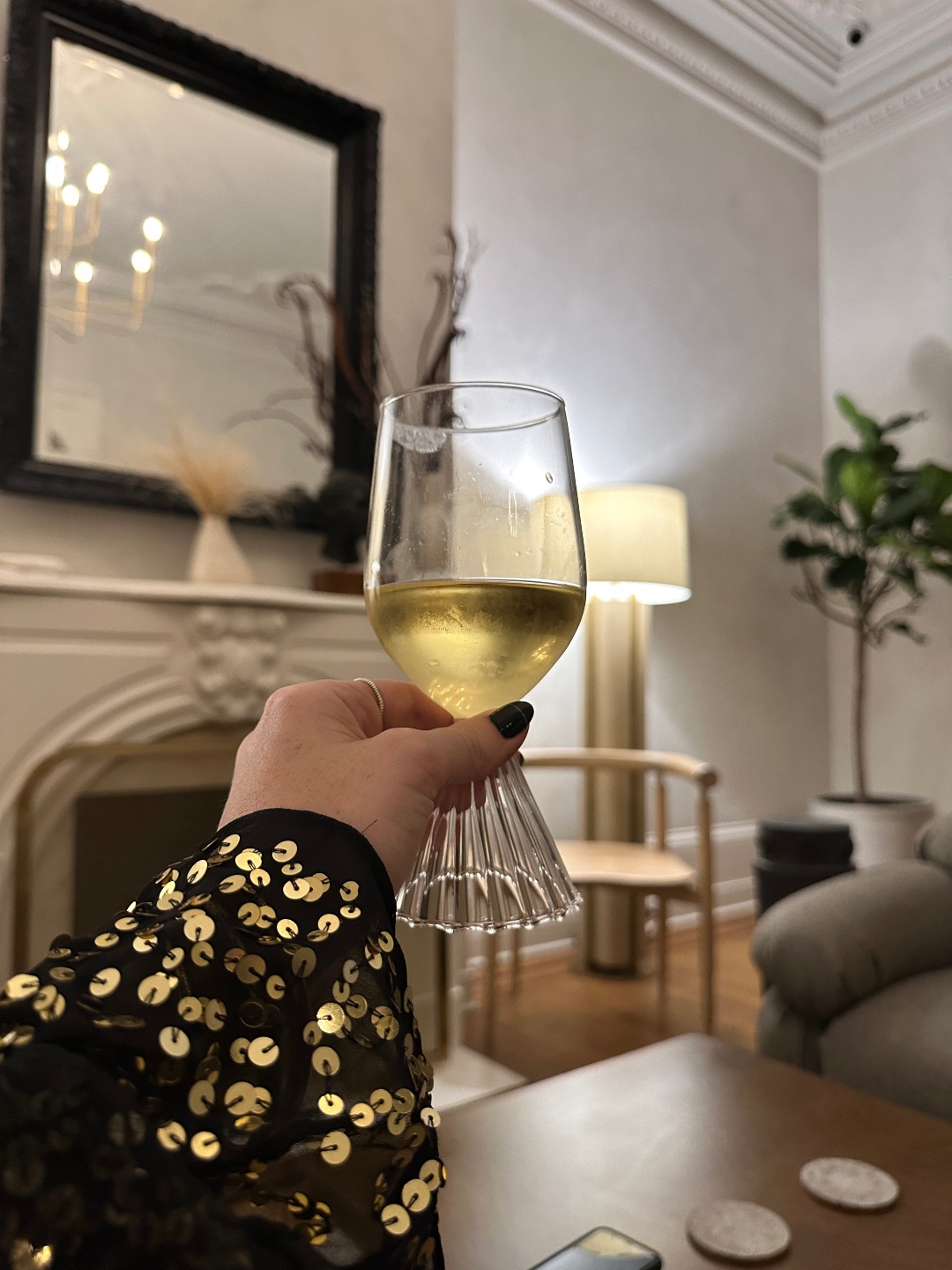 woman holding a glass of white wine for and sharing 6 Goals for 2023 woman holding a glass of white wine for and sharing 6 Goals for 2023