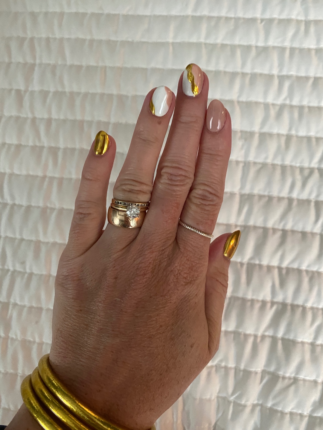 spring and summer nail polish Meghan Grant showing her gold, white, and nude manicure